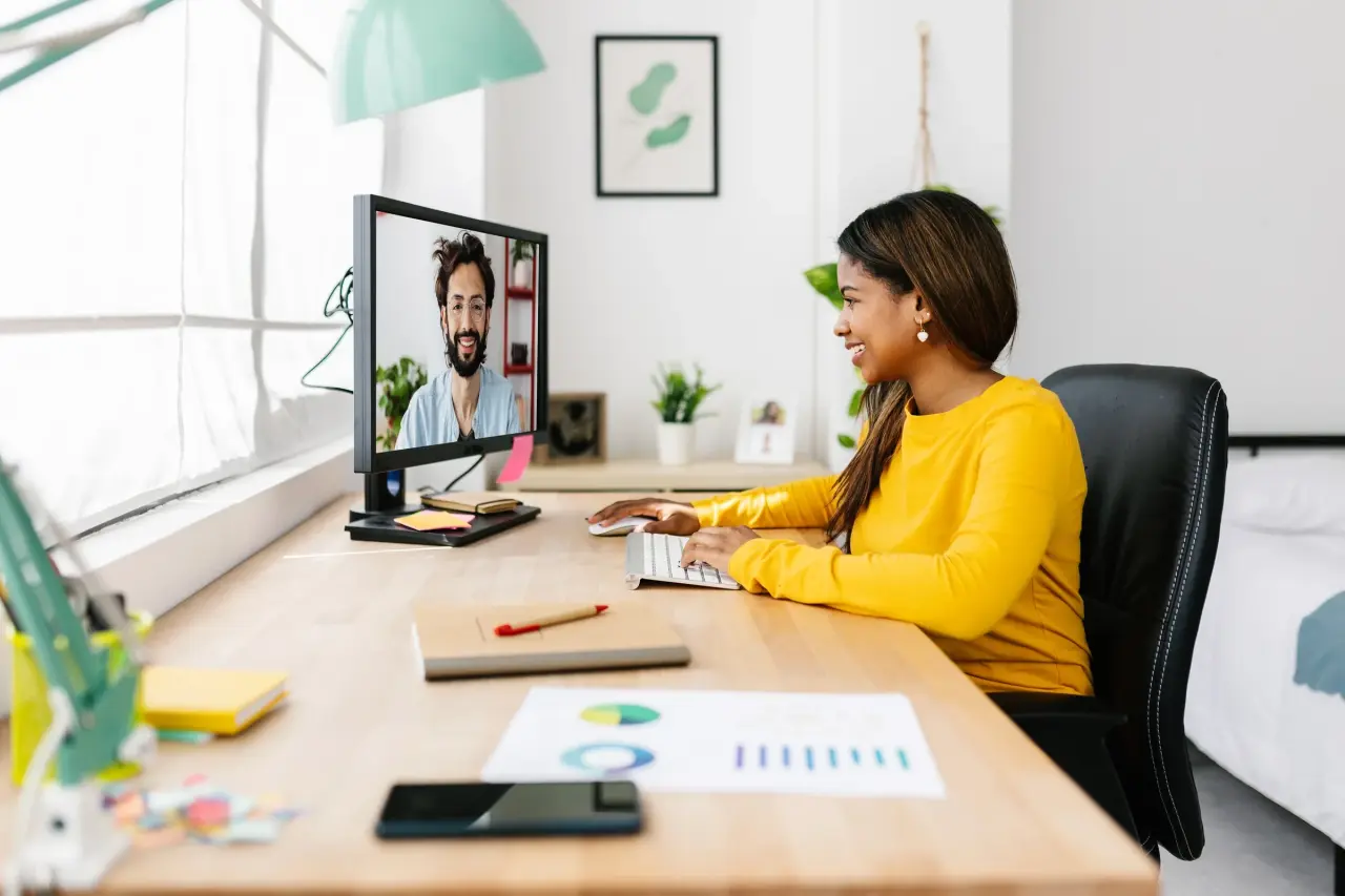 Woman behind desk videocall